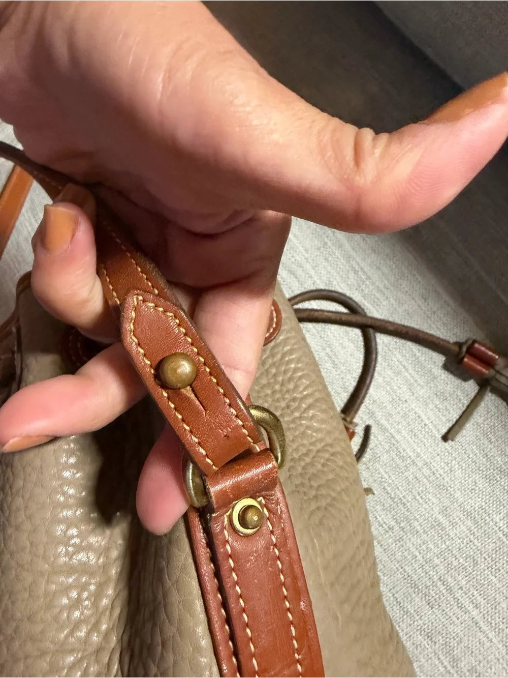 Dooney & Bourke Taupe Pebbled Leather Bucket Bag with Tan Trim